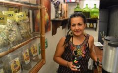 Ximena in the shop with some coca-infused rum